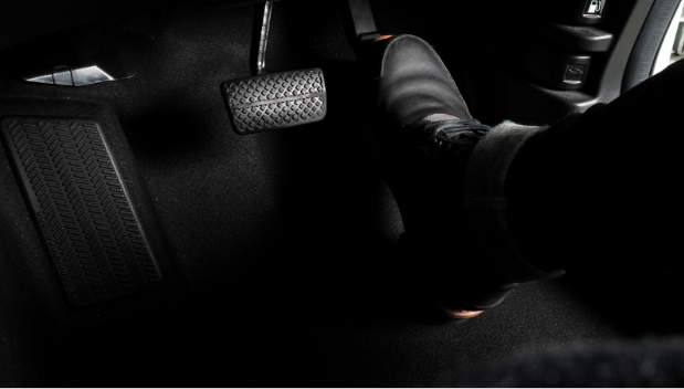 Driver's foot pressing on the gas pedal